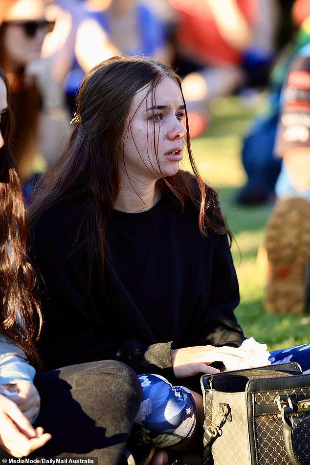 Onlookers broke down in tears during the emotional candlelight vigil