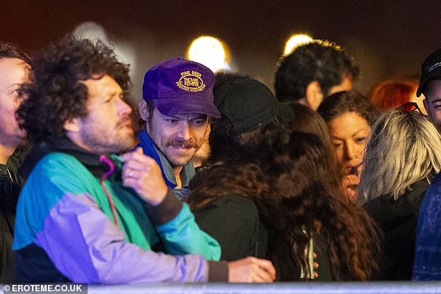 Harry went largely unnoticed in the crowd who were enjoying the set from Jamie xx