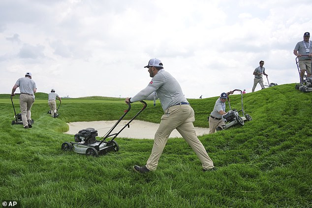 The rough at Oakmont Country Club is trimmed by employees pushing around lawn mowers