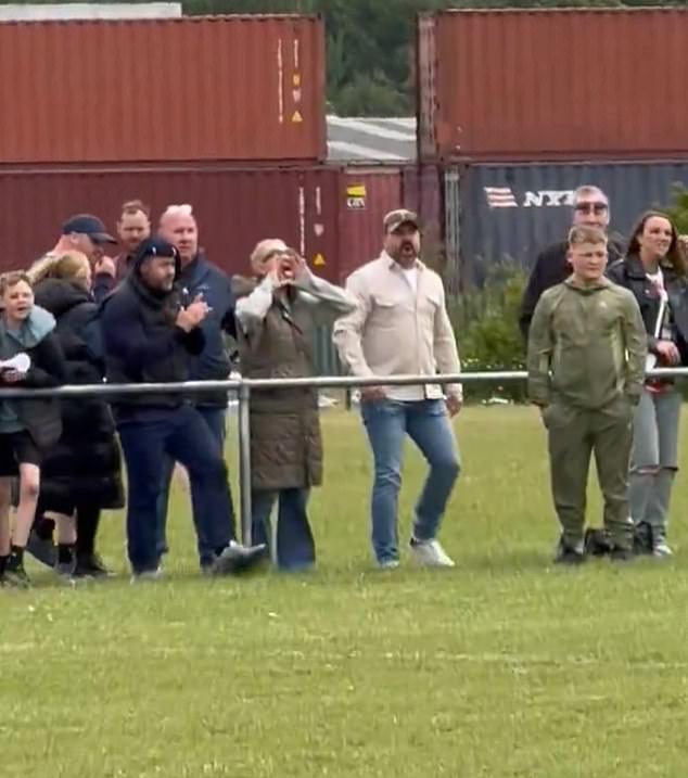 Fans appeared to be delighted when the player missed the kick with one woman seen cupping her hands to her mouth and jeering the player again