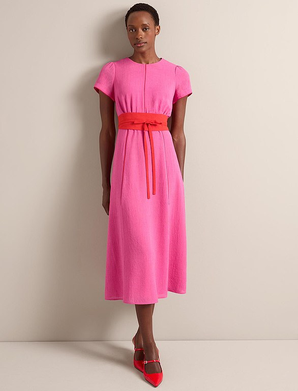 One of this season's bestsellers is the Rosie dress, offered in a vibrant hot pink and crimson colourway
