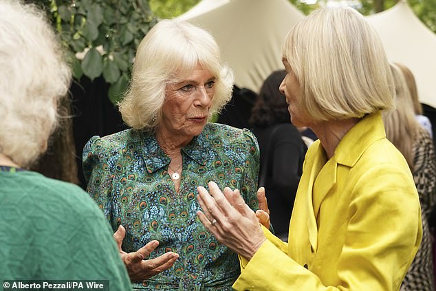 Camilla was snapped basking in London's 23-degree weather while conversing with those who were invited to the occasion, as they posed for pictures together in a picturesque garden