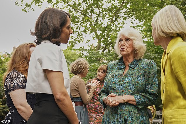 The queen wore her signature platinum blonde tresses down in a wavy blow-dry and opted for natural makeup with a hint of pink lipstick