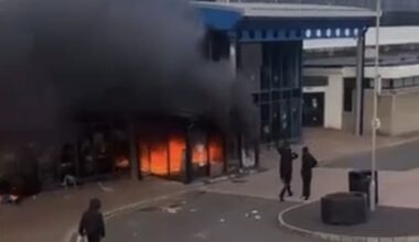 Distressing footage taken outside Larne Leisure Centre on Wednesday night shows a group of hooded thugs torching the building, which is understood to have held Romanian immigrants