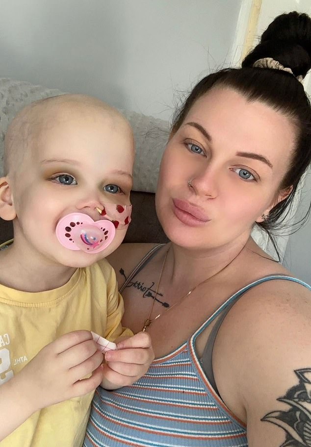 Carlyn Dooley (right), from Corby, rushed her daughter, Paisley (left), to hospital on April 2 after she woke up with black rings around her eyes