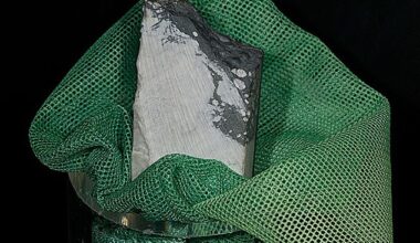 Unlike fictional kryptonite, jadarite at London's Natural History Museum (pictured) is white and powdery, emits no radiation, and comes from Serbia rather than outer space