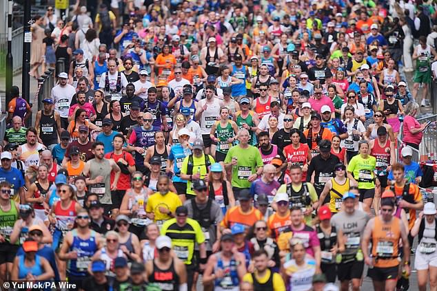 Those with a longer ring finger may perform better in long-distance events, scientists said. Pictured: Runners taking part in the London marathon earlier this year