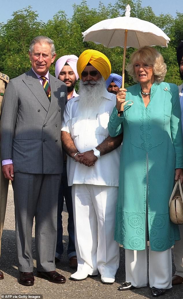 Prince Charles and the Duchess of Cornwall with Punjab state public relations minister Sewa Sekh ahead of the opening ceremony of New Delhi's Commonwealth Games in 2010