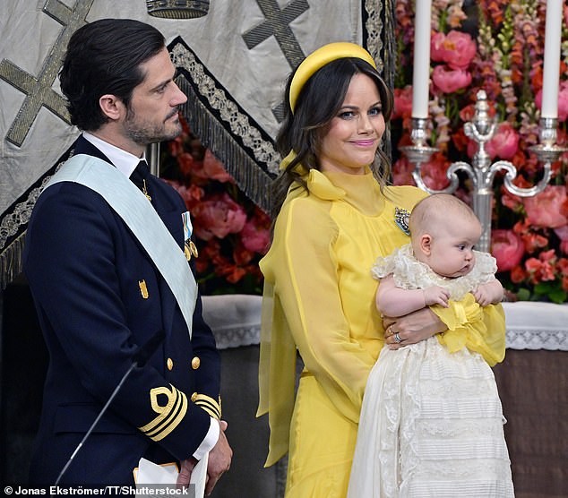 Prince Carl Philip and Princess Sofia with Princess Ines during the christening in Drottningholm Palace Chapel