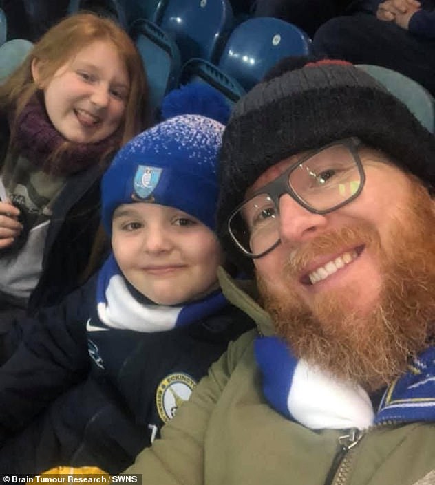 Life-long Sheffield Wednesday football fan Jamie Acaster, from Eckington in Derbyshire, suddenly found it to difficult to recall player's names and follow conversations. Pictured, Jamie with daughter Ava and son Harry at a Sheffield Wednesday match