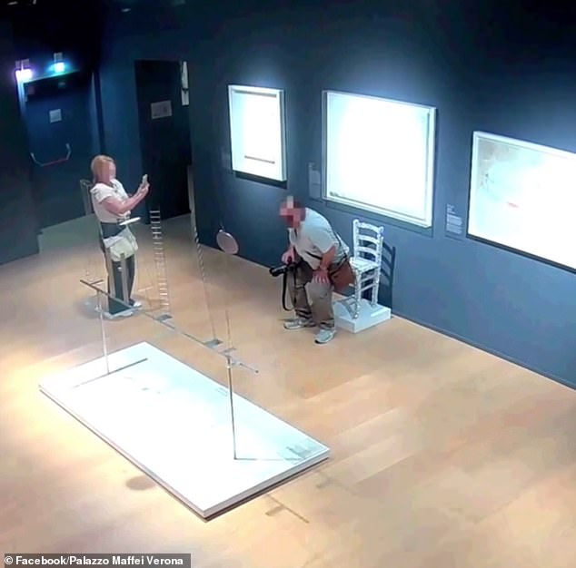 But the man took this one step further, and can be seen hovering above the exhibit