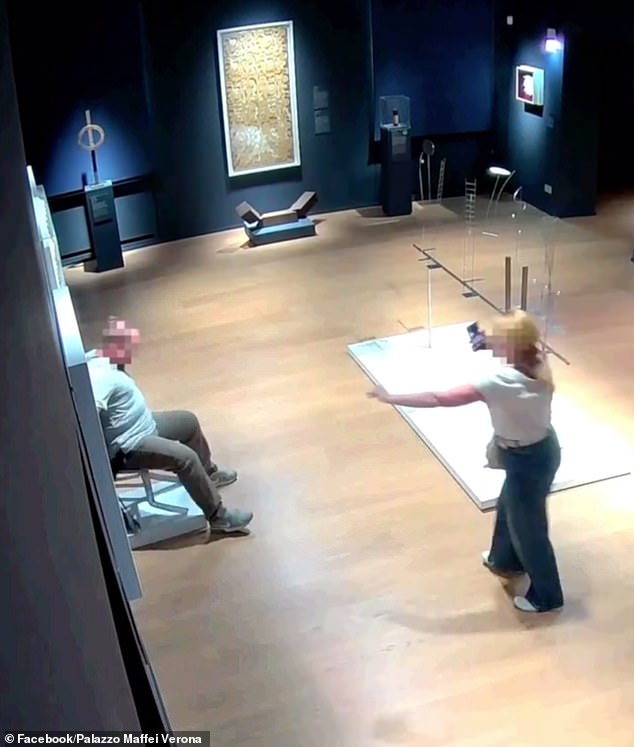 Another angle of the incident shows the man with his back against the wall as the chair buckles underneath him