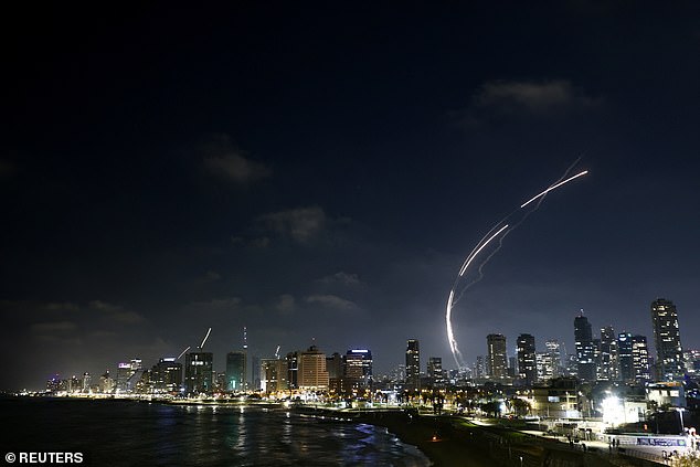 Missiles launched from Iran are intercepted as seen from Tel Aviv, Israel