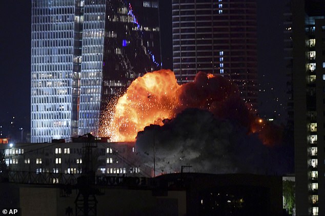 A missile was seen exploding into a building in Tel Aviv after Iran launched a salvo of missiles against Israel