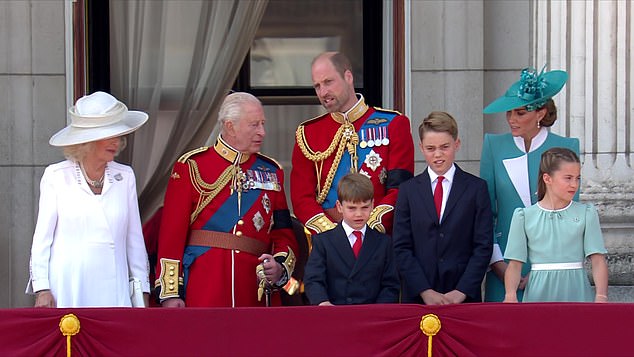 The King and Prince William speak with one another as the royal family watches a flypast to mark the King's official birthday