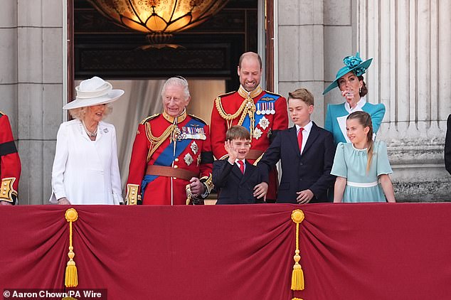 The youngest member of the royal family drew smiles from his parents and grandparents as he gave a cheeky grin