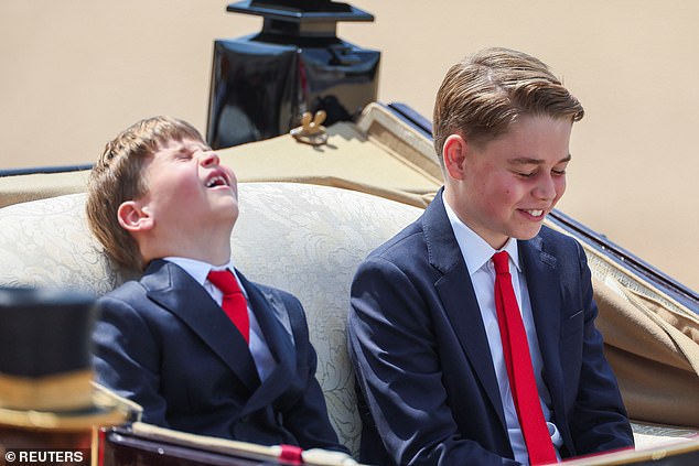 Prince George and Prince Louis laugh at a joke as they prepare to return to Buckingham Palace to appear on the balcony