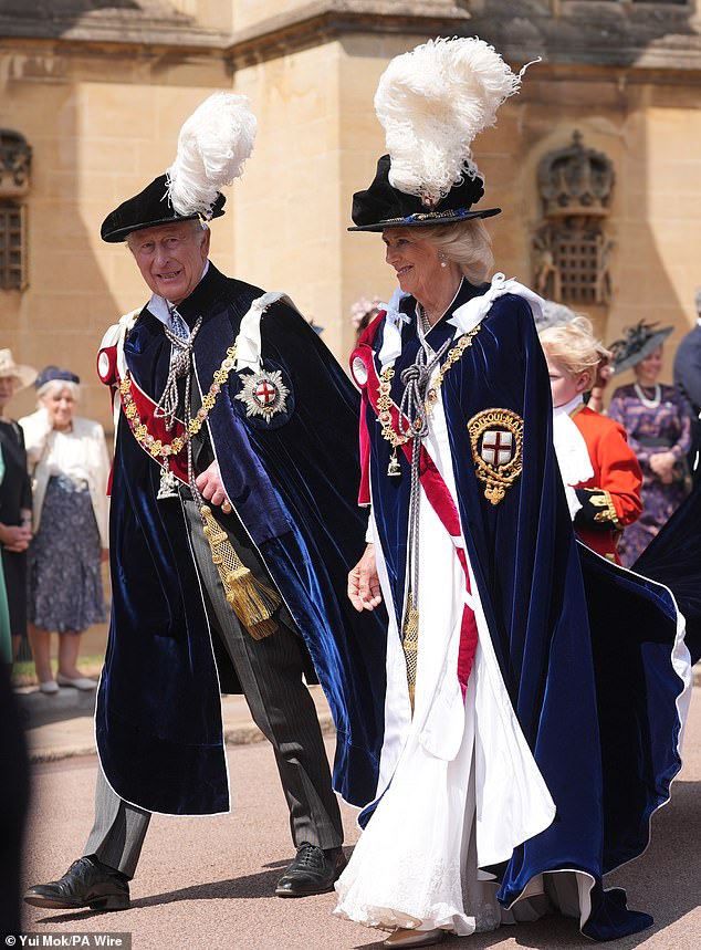 King Charles and Queen Camilla arriving at St George's Chapel for today's ceremony. The Queen also opted to wear a white ensemble - like Catherine's £400 Self Portrait dress