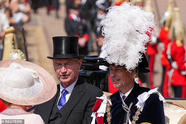 Britain's Prince Edward, Duke of Edinburgh (right), and Vice-admiral Sir Timothy Laurence ride in a carriage after the Order of the Garter service
