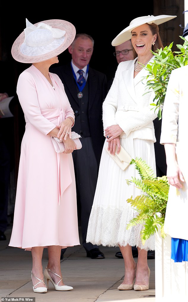 As the elderly Military Knights of Windsor, who led the procession, appeared into view and made their way slowly past them, the two women appeared tickled by something, laughing together