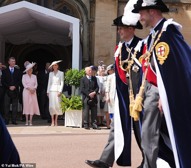 When Prince William came into view further up the hill, he appeared to keep glancing towards his wife but she was too busy chatting to the Duchess