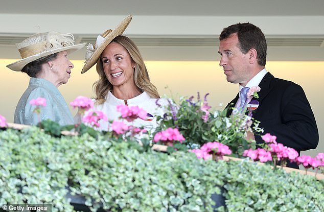 She was seen deep in conversation with Peter's mother, Princess Anne, on the balcony at the racecourse this afternoon