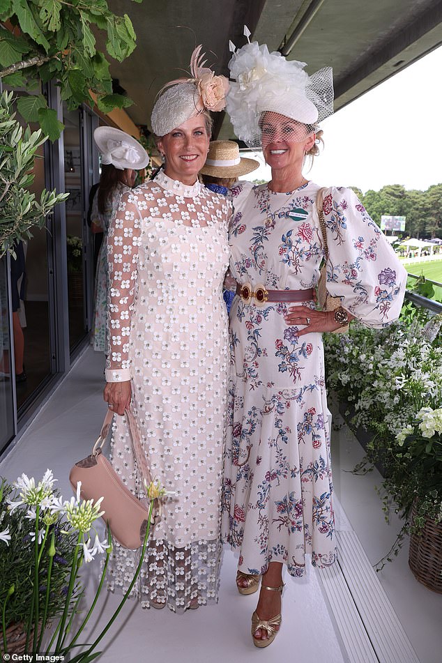 Sophie, Duchess of Edinburgh, looked glamorous in an ivory applique daisy lace ensemble from Suzannah London. Pictured with Fiona Howden