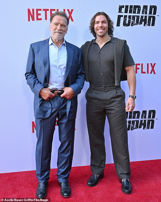 Much ado was made over how Arnold posed separately with his 27-year-old love child Joseph Baena (R), whom he welcomed during a secret affair with his housekeeper Mildred 'Patty' Baena that resulted in the end of his 25-year marriage