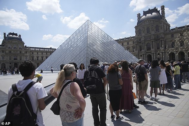 Other images showed tourists waiting in line outside the museum's iconic glass pyramid after it failed to open