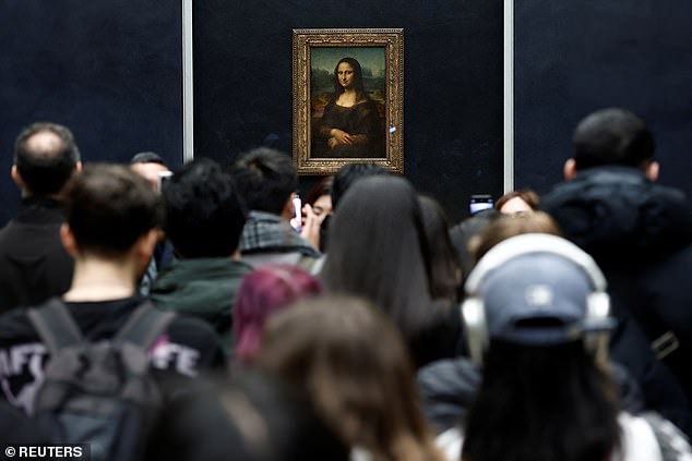 Visitors look at the painting "Mona Lisa" (La Joconde) by Leonardo da Vinci at the Louvre Museum in Paris, France, January 29, 2025