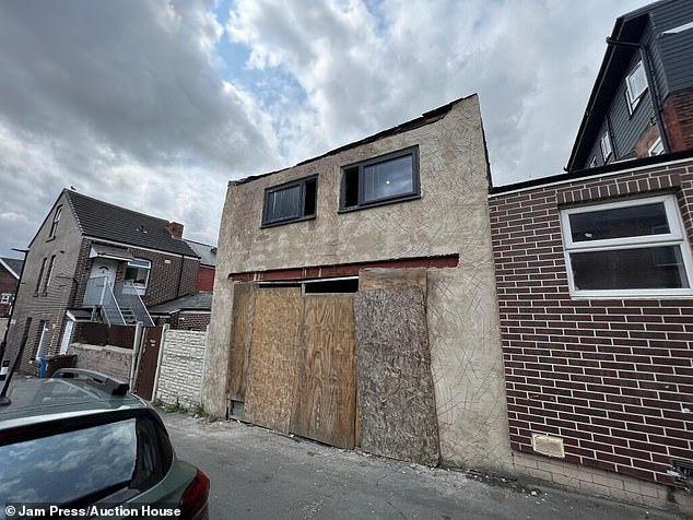 The inside has been left exposed to the elements with crumbling bricks and a hole where the window should be