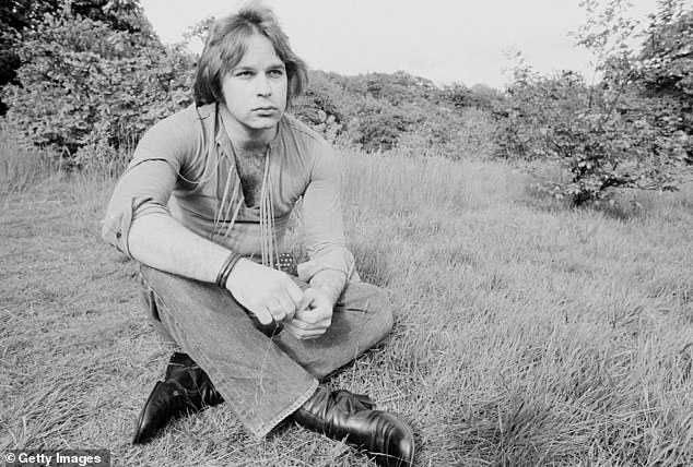 Christie was pictured in 1972 seated in a field, clad in the styles of the time