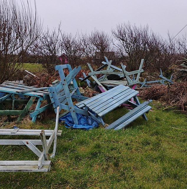 A pile of picnic tables which Mrs Mularczyk says have been dumped and left at the park