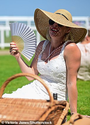 The fan proved to be the perfect accessory for these fashionable racegoers
