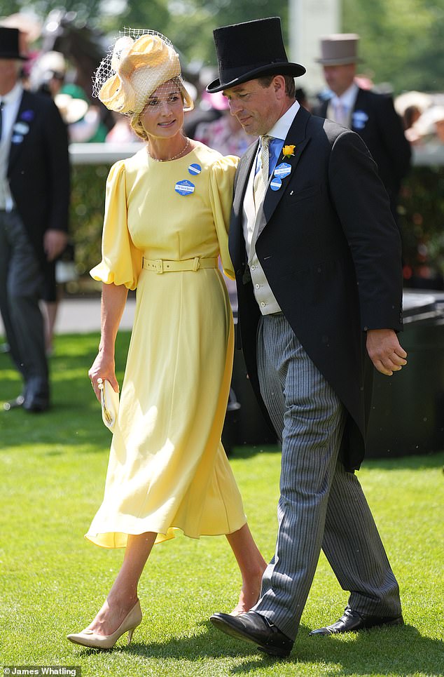 Loved-up: Harriet gave Peter an affectionate glance as they once again went public with their romance