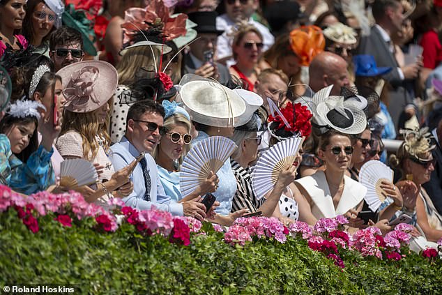Fans were the best accessory of the day with many racegoers opting for them in the heat