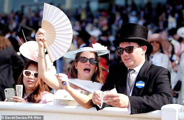 Cheers! A racegoer celebrates during day three of Royal Ascot