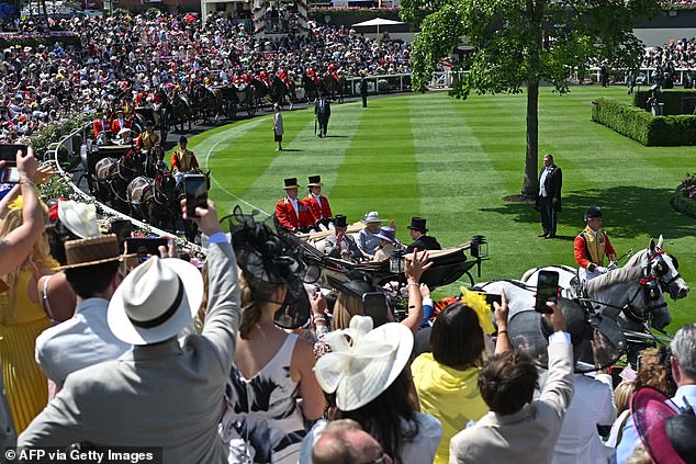 Britain's King Charles III and Britain's Queen Camilla arrive in a horse-drawn carriage