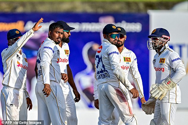 Sri Lanka's Tharindu Rathnayake (second left) bowled with both arms against Bangladesh