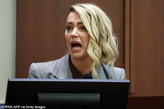 Amber Heard testifies during the Depp vs Heard defamation trial in May 2022. Heard is unable to pay her ex-husband Johnny Depp more than $10million in damages after the jury took the side of the Pirates of the Caribbean star