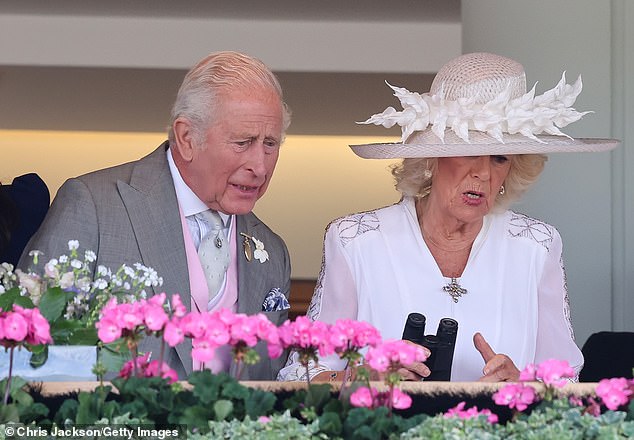 King Charles III and Queen Camilla watch a race on day four of Royal Ascot