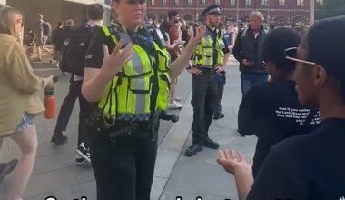 The short clip from the bizarre confrontation sees the woman cop telling the evangelists 'it's so loud'