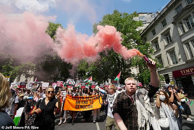 People take part in a march organised by the Palestine Solidarity Campaign