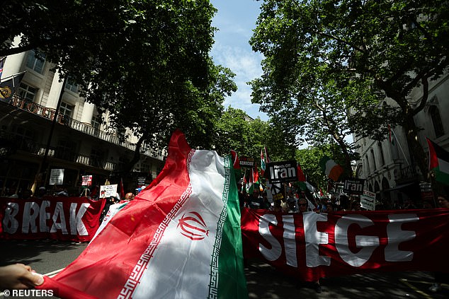 Protestors were even seen waving an Iranian flag as the conflict between the two countries continues to escalate