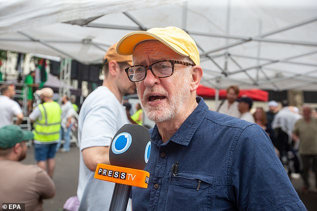 Mr Corbyn giving an interview to Iranian Press TV during the protest