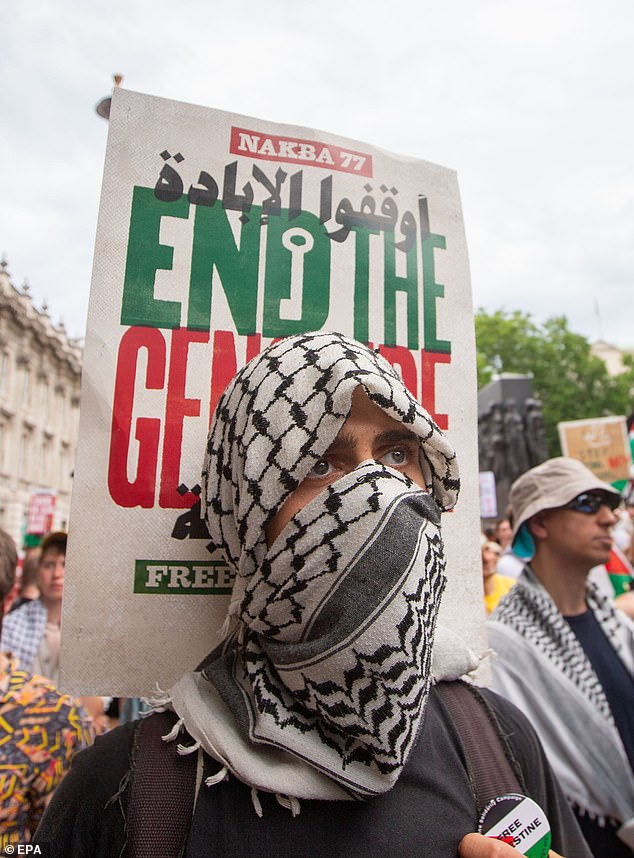 ro-Palestinian demonstrators are seen in Whitehall during a national demonstration for Palestine