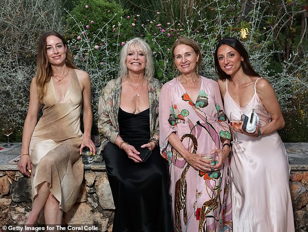 The 41-year-old and his mother were joined at the event by Ty's wife, Steve Harris of Iron Maiden's daughter, Faye (Pictured left alongside Jo)