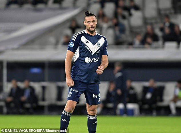 Andy Carroll is seen here playing for French football team Bordeaux against Saint-Pryve Saint-Hilaire last November - he has since left the club