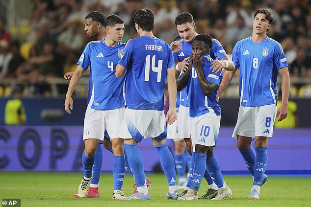 No 10 Gnonto was consoled by his team-mates during Italy's quarter-final defeat by Germany