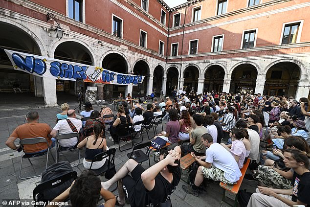 Campaign group No Space for Bezos has organised a huge protest for next Saturday with demonstrators being encouraged to bring googles and inflatables so they can dive into canals and disrupt taxis ferrying guests. Pictured: People gathered on June 13 to protest against the wedding